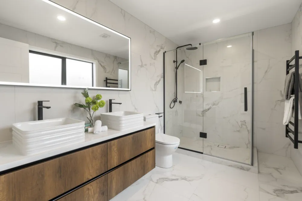 Timber bathroom vanity with white basin and glass shower
