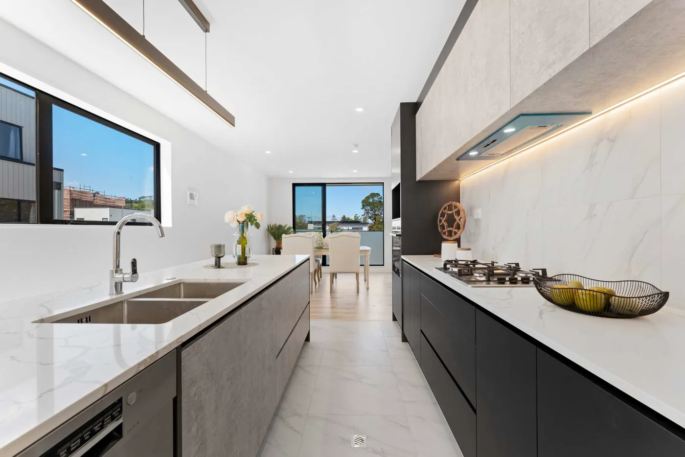White and charcoal kitchen with full-height cabinetry